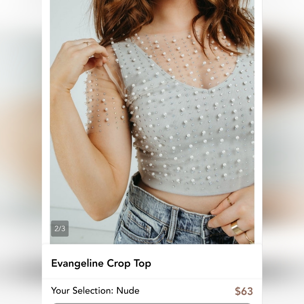 Long sleeve clear Pearl fashion top.